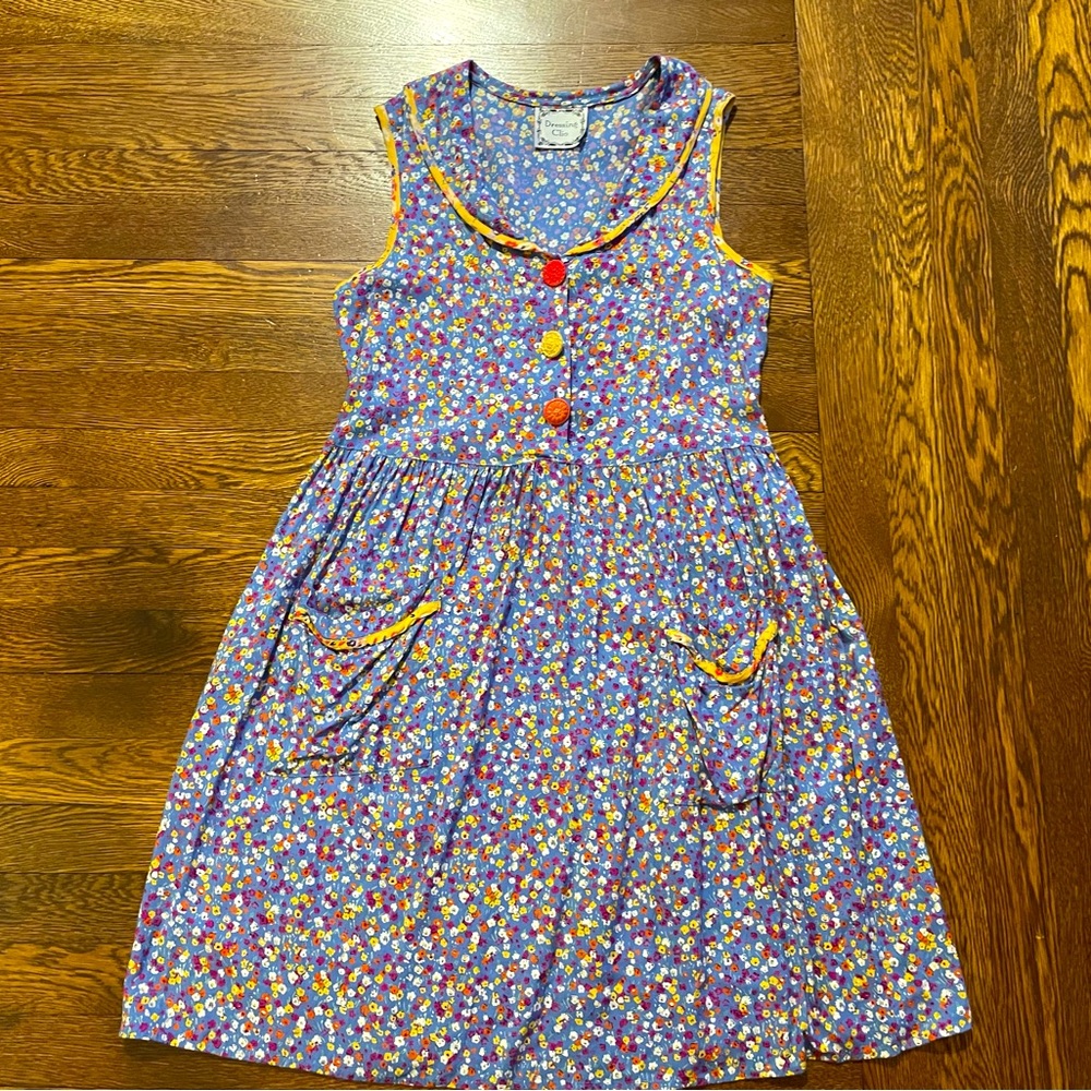 Sleeveless Purple Floral Dress with Yellow Trim and Button Accents